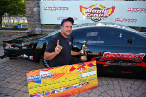 Mike Decker with the big NEOPMA Pro Mod check and NHRA "WALLY" in Winners Circle